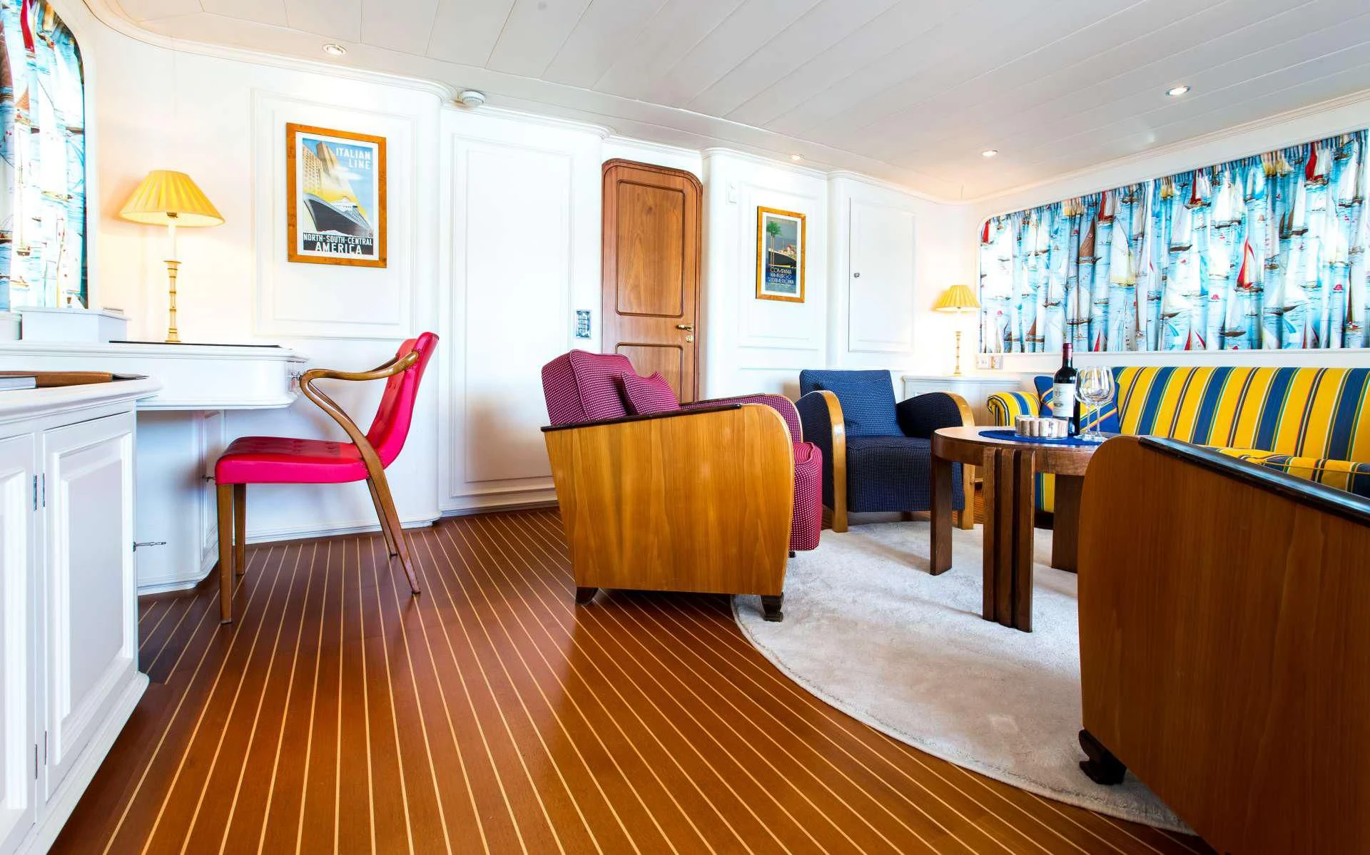 a large room with a table and chairs aboard STAR OF THE SEA Yacht for Sale