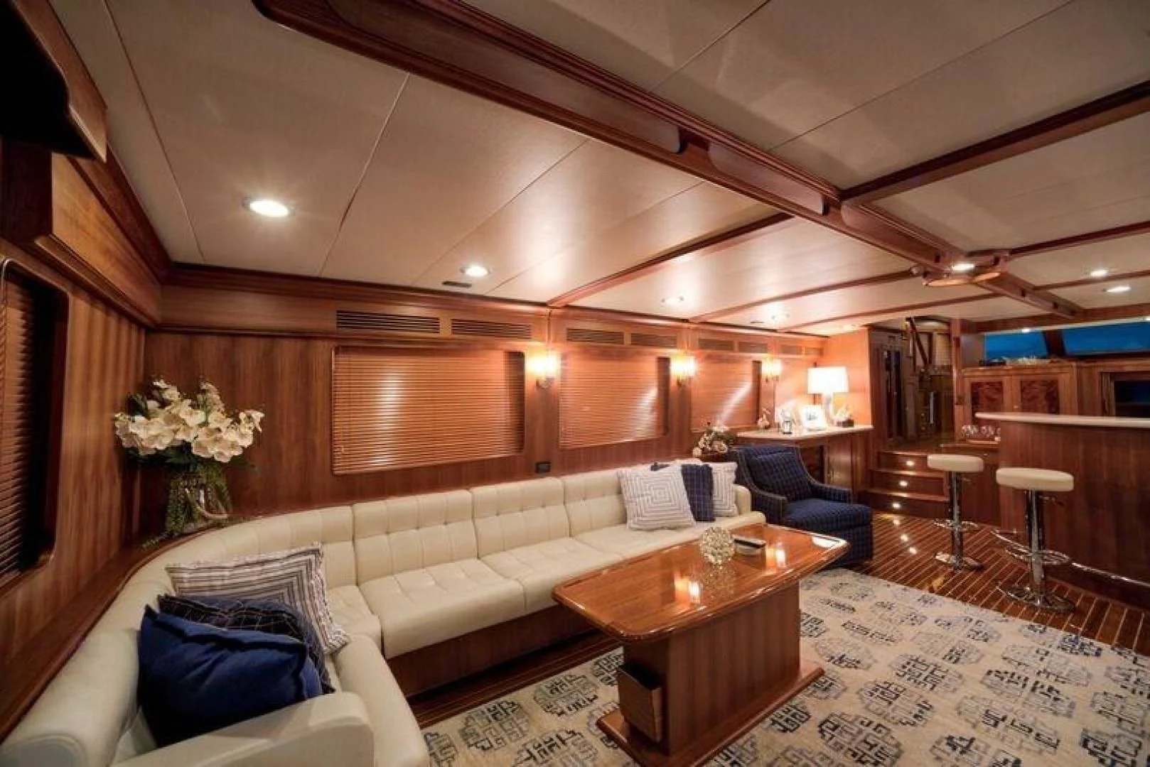 a room with a couch and a table aboard GRACIE Yacht for Sale