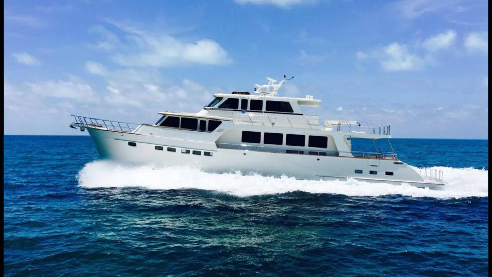 a white yacht in the water aboard GRACIE Yacht for Sale