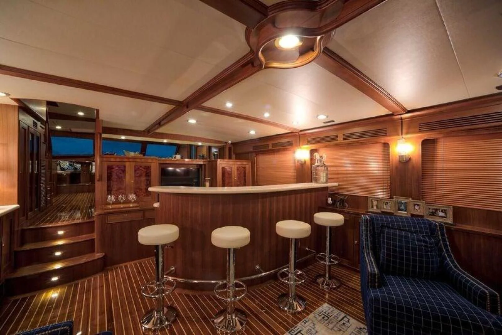 a room with stools and stools aboard GRACIE Yacht for Sale