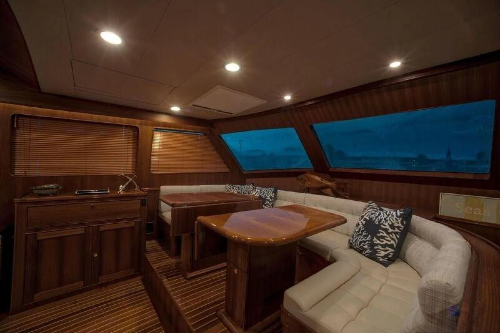 a room with a couch and a table aboard GRACIE Yacht for Sale