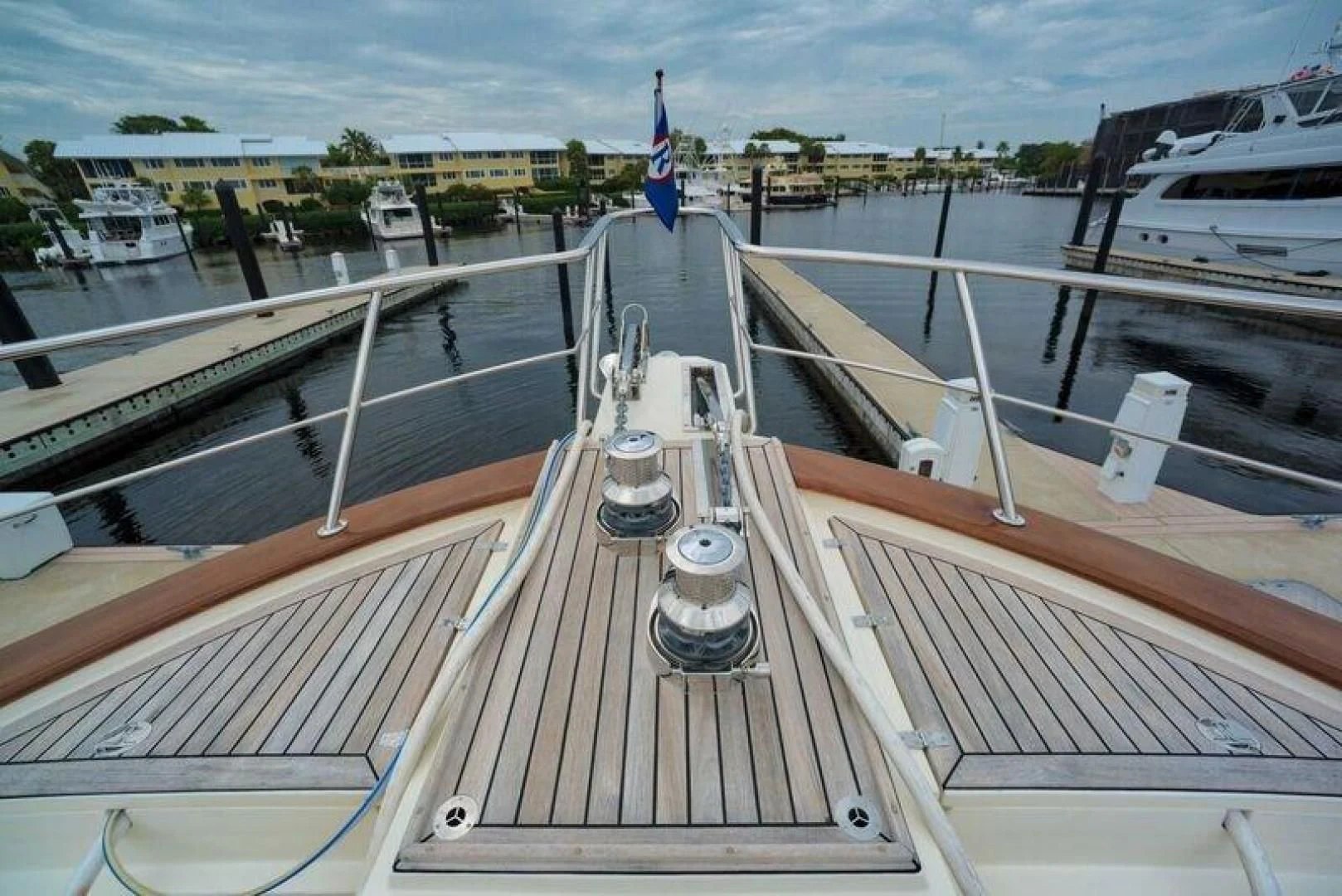a deck with a deck and a flag on it aboard GRACIE Yacht for Sale