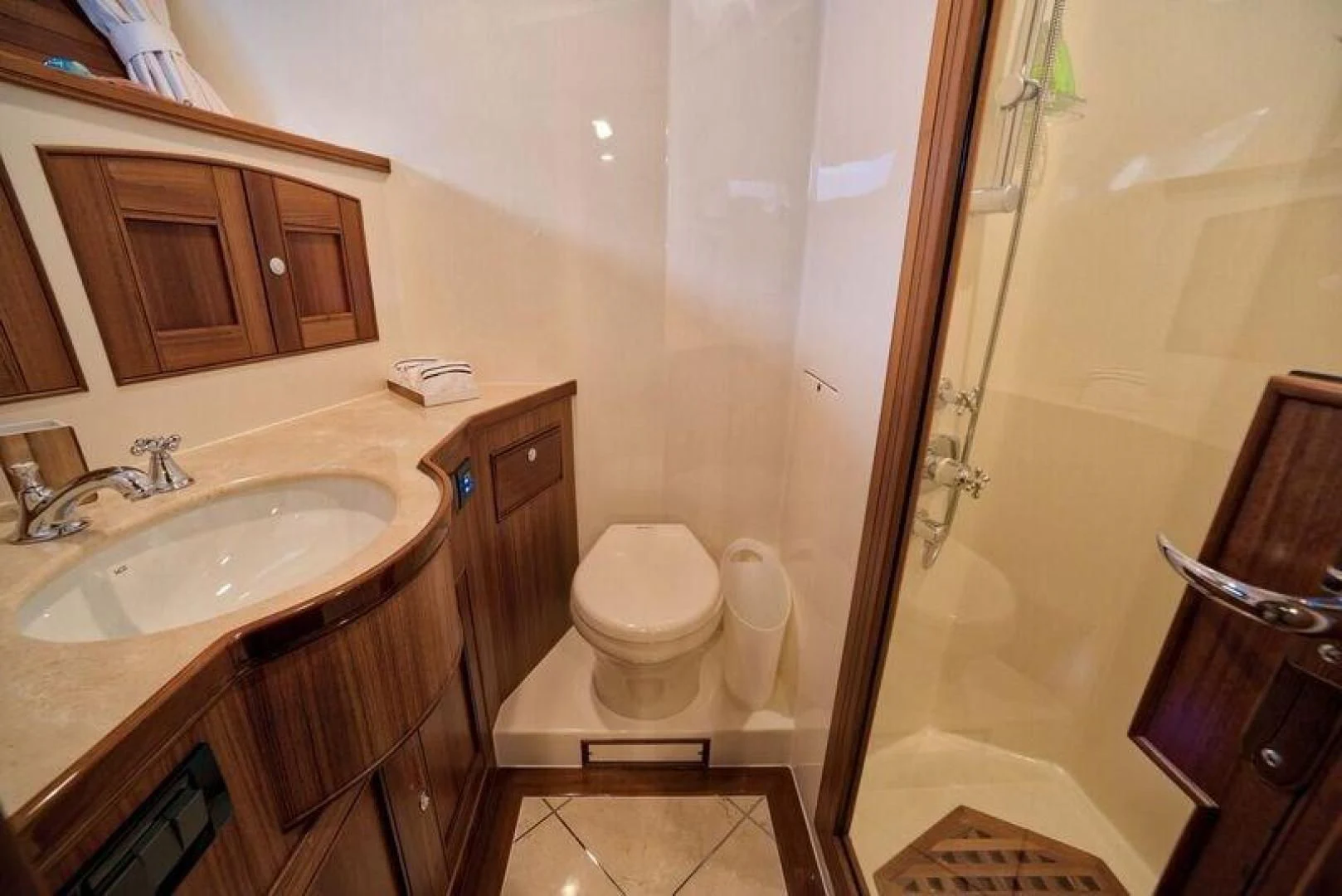 a bathroom with a sink toilet and a shower aboard GRACIE Yacht for Sale