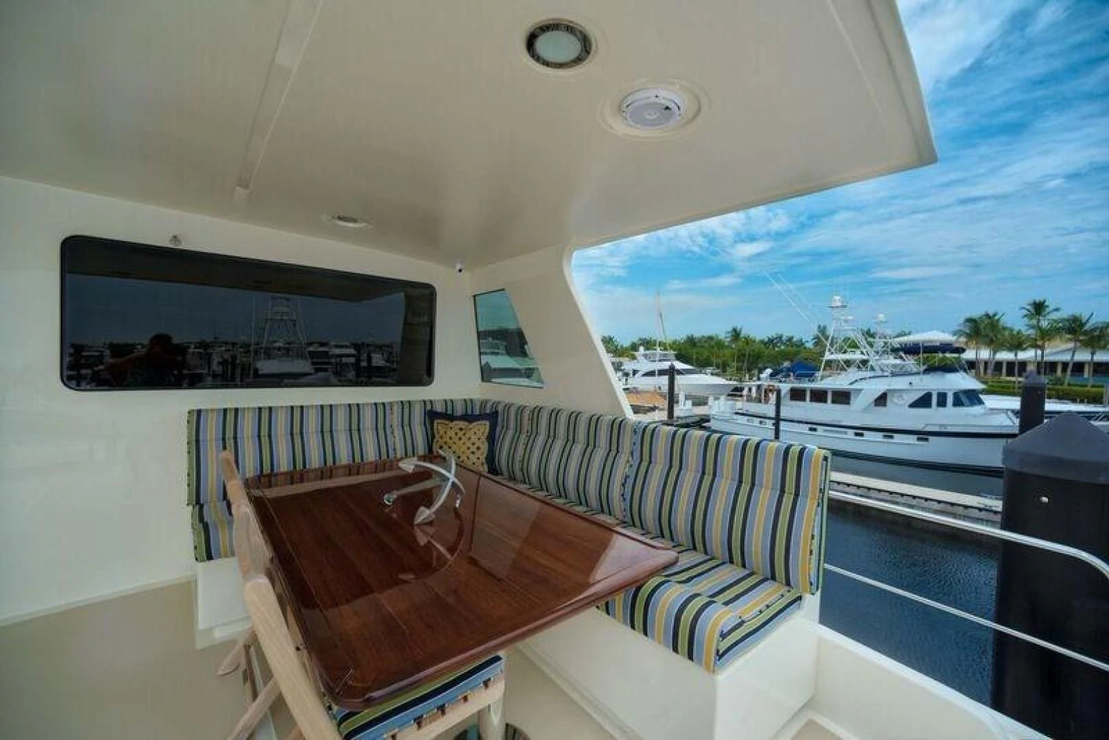 a balcony with a view of the water and boats aboard GRACIE Yacht for Sale