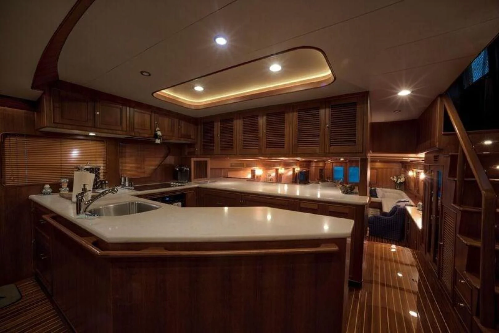 a kitchen with wooden cabinets aboard GRACIE Yacht for Sale