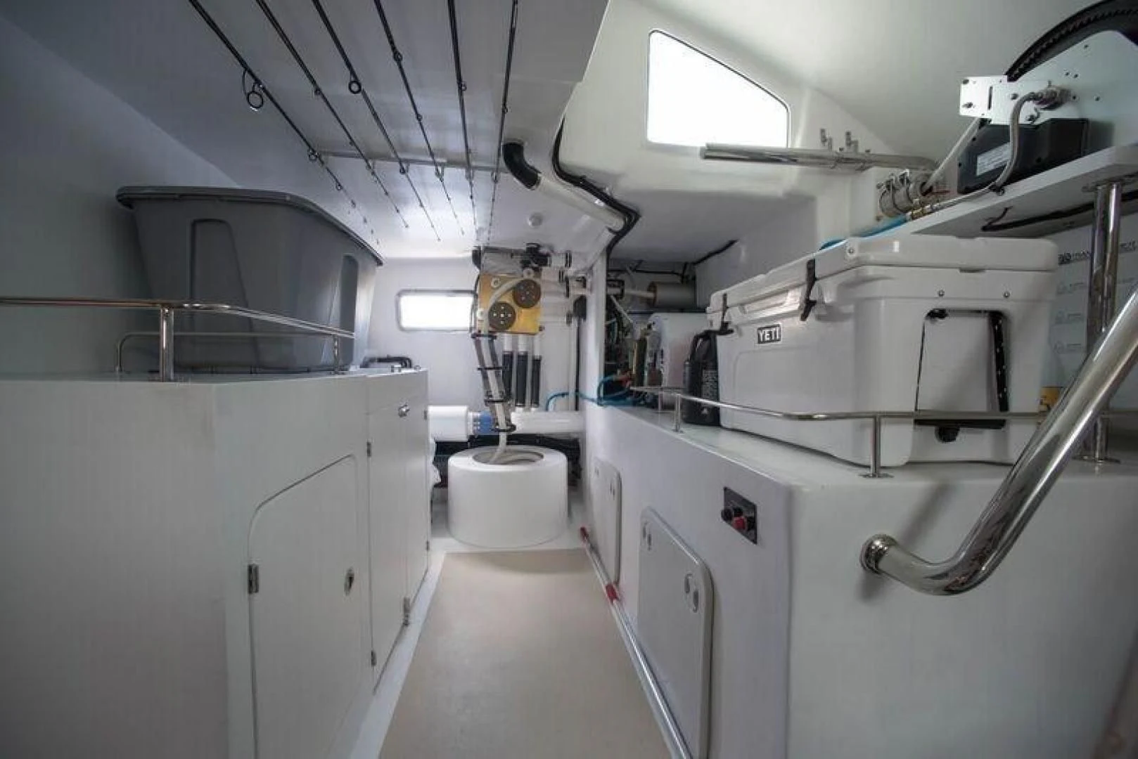 a room with white cabinets and pipes aboard GRACIE Yacht for Sale
