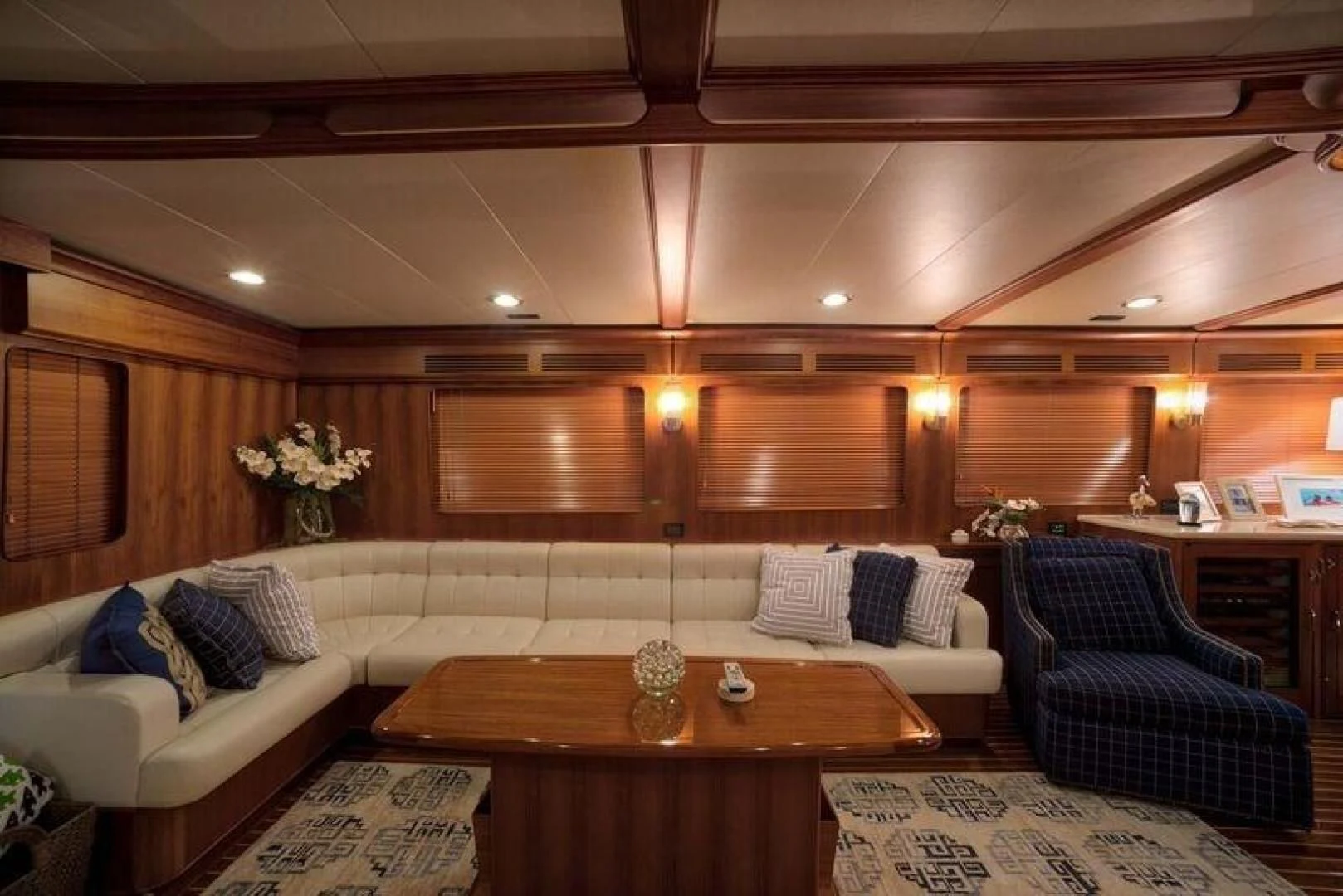 a room with a couch and a table aboard GRACIE Yacht for Sale