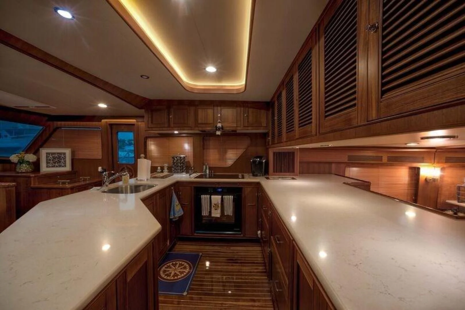 a kitchen with a large island aboard GRACIE Yacht for Sale