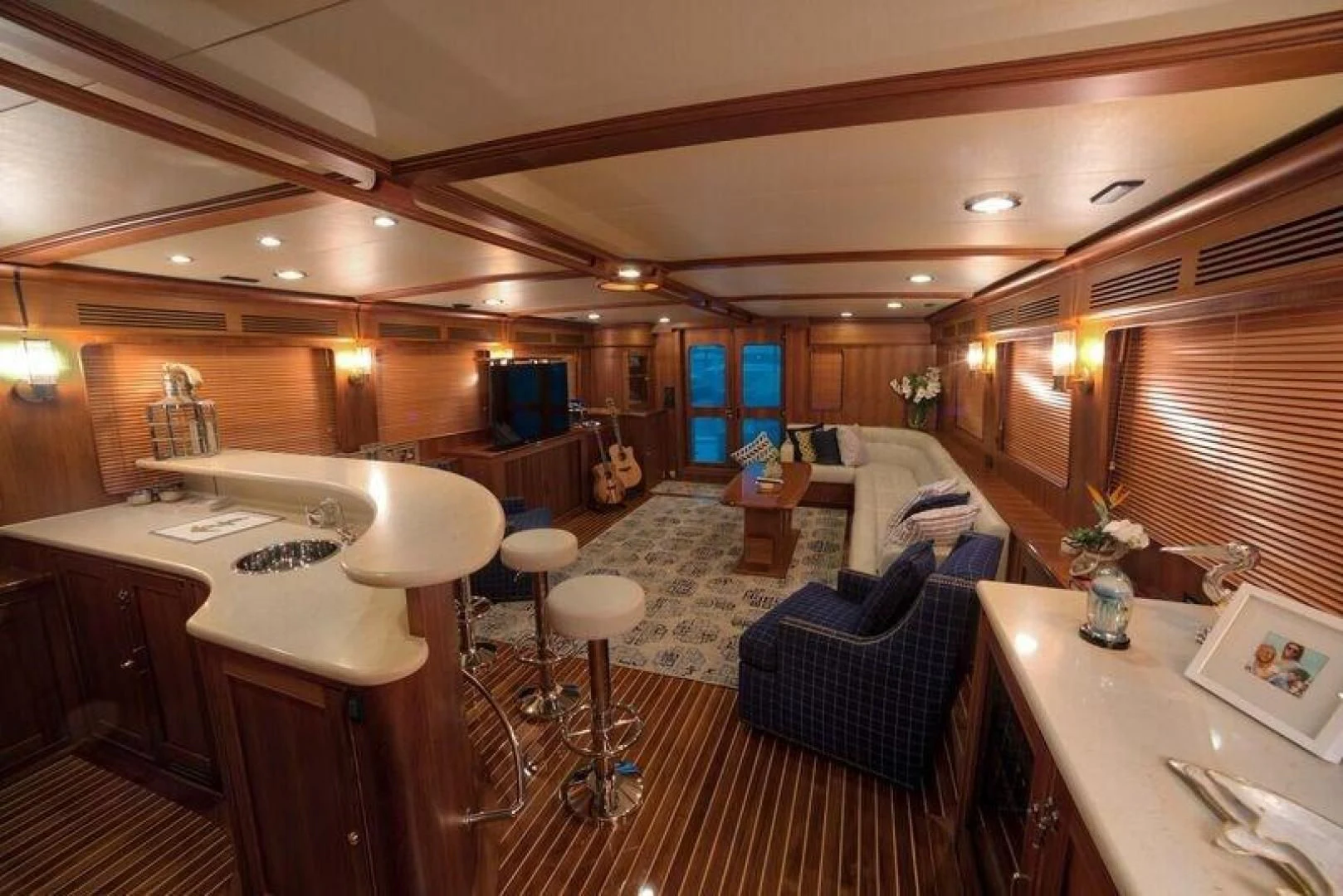 a room with a table and chairs aboard GRACIE Yacht for Sale