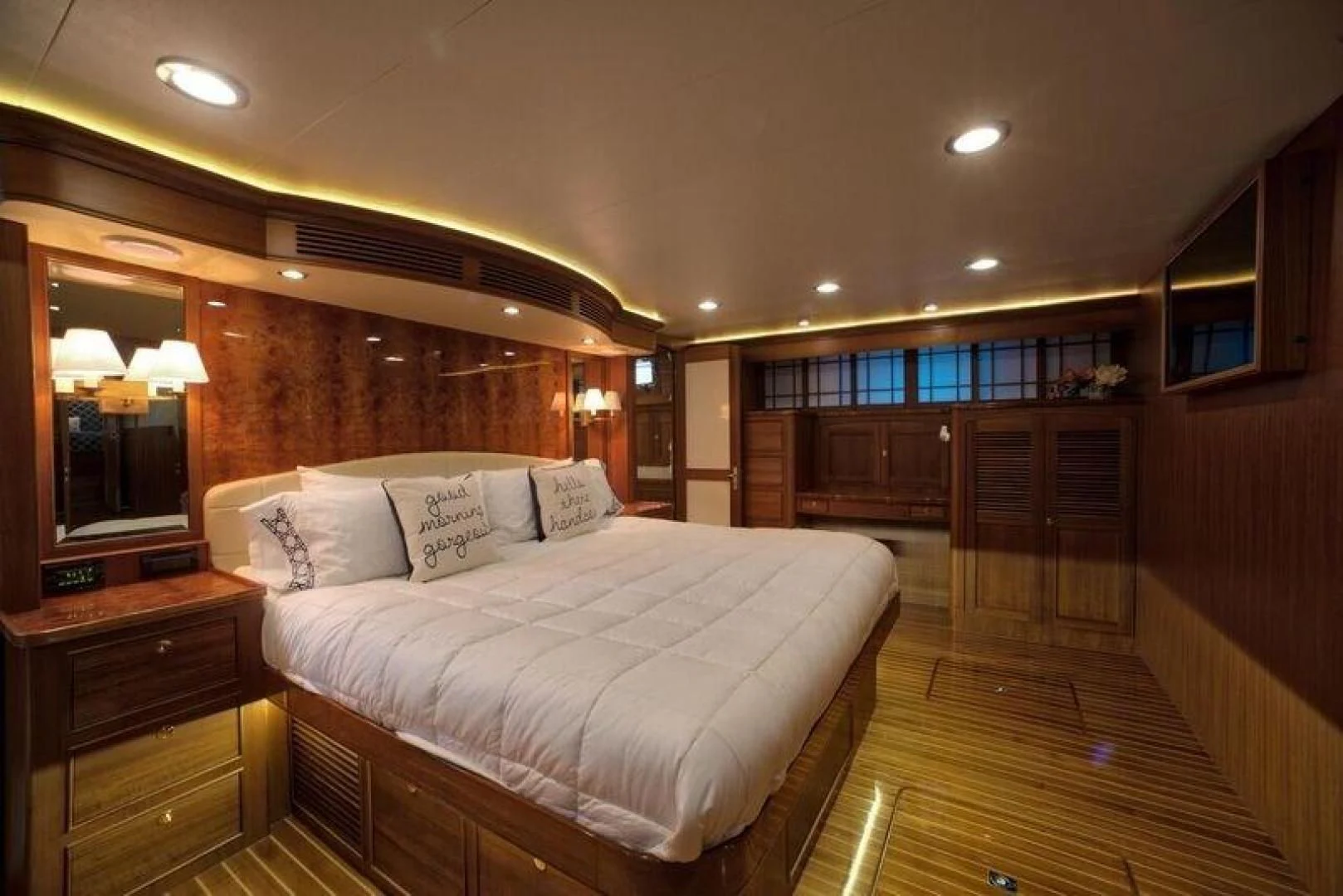 a large bedroom with a large bed aboard GRACIE Yacht for Sale