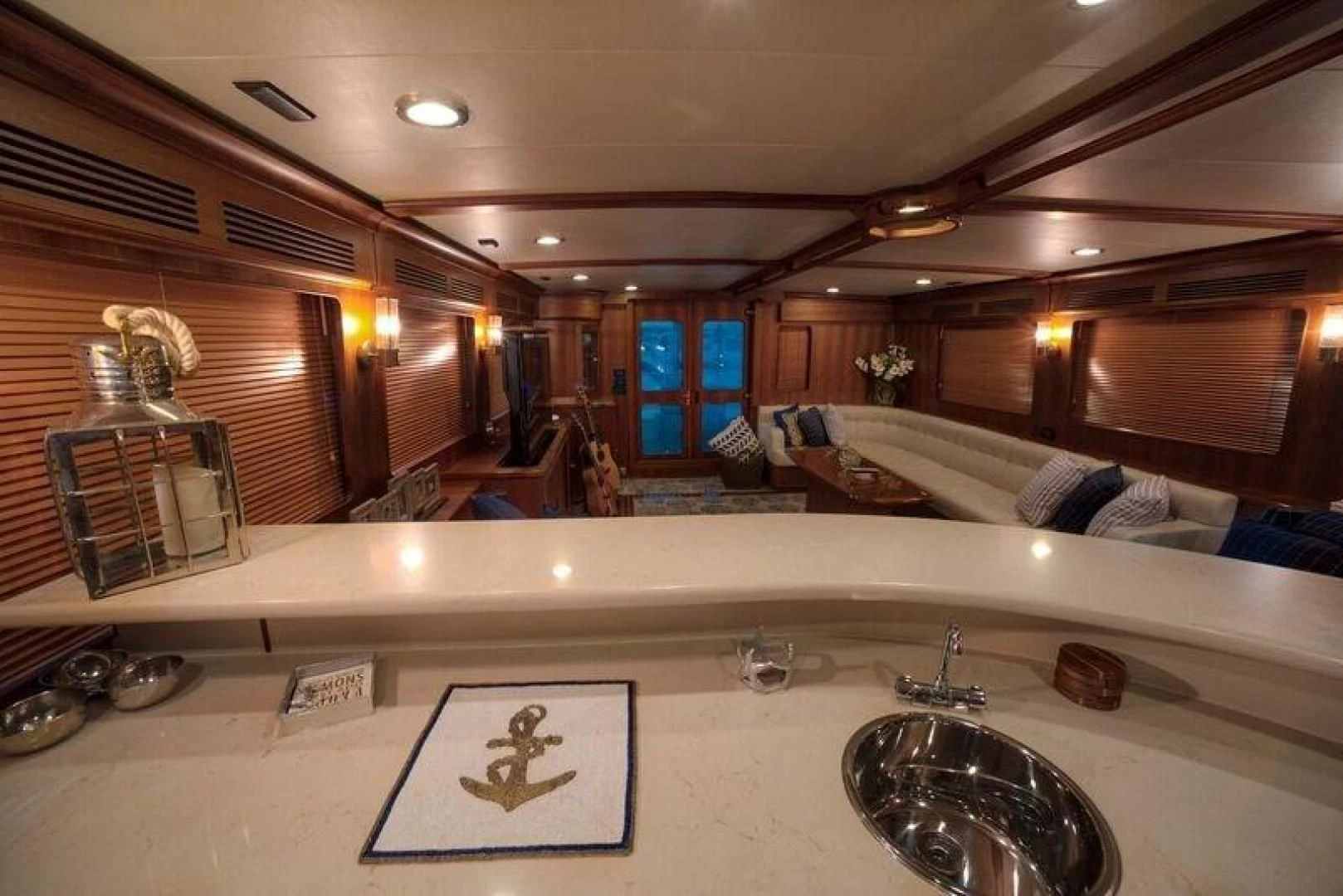 a room with a couch and a fan aboard GRACIE Yacht for Sale