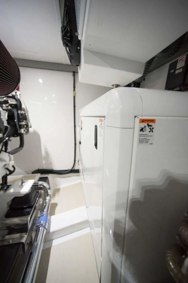 a white machine in a room aboard GRACIE Yacht for Sale