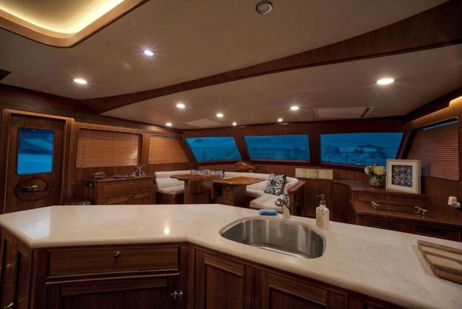 a large kitchen with a large window aboard GRACIE Yacht for Sale