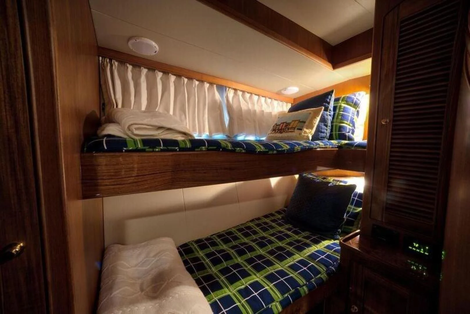 a bed with a wood frame aboard GRACIE Yacht for Sale
