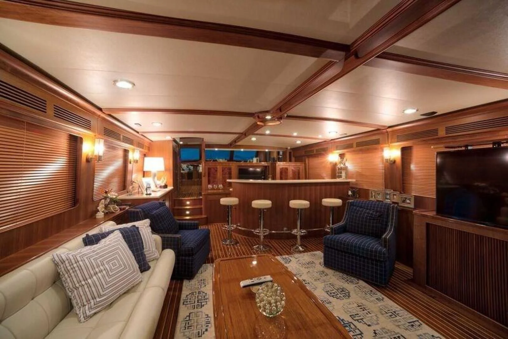 a room with a couch and a table and chairs aboard GRACIE Yacht for Sale