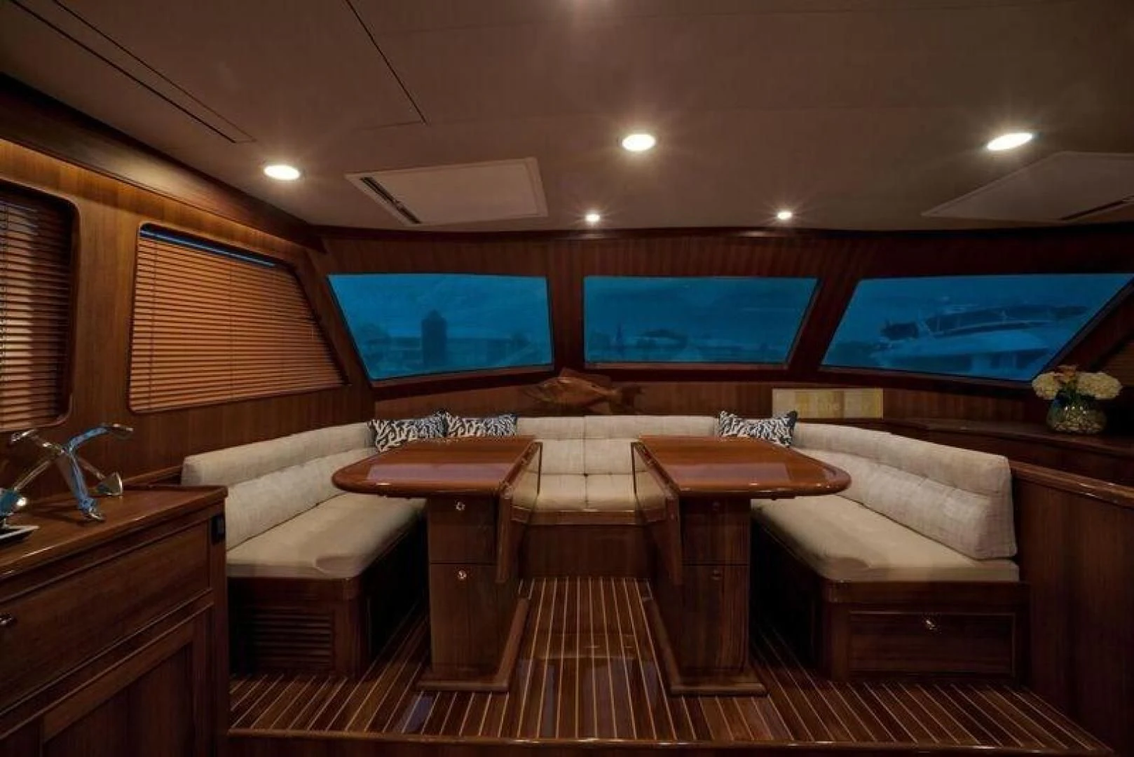 a room with a table and couch aboard GRACIE Yacht for Sale