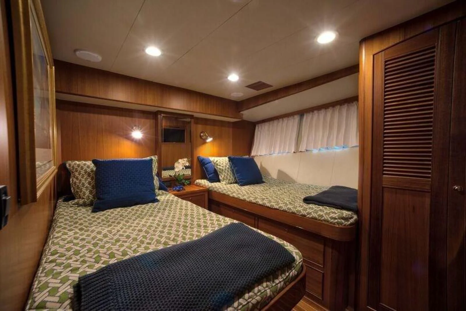 a couple of beds in a hotel room aboard GRACIE Yacht for Sale
