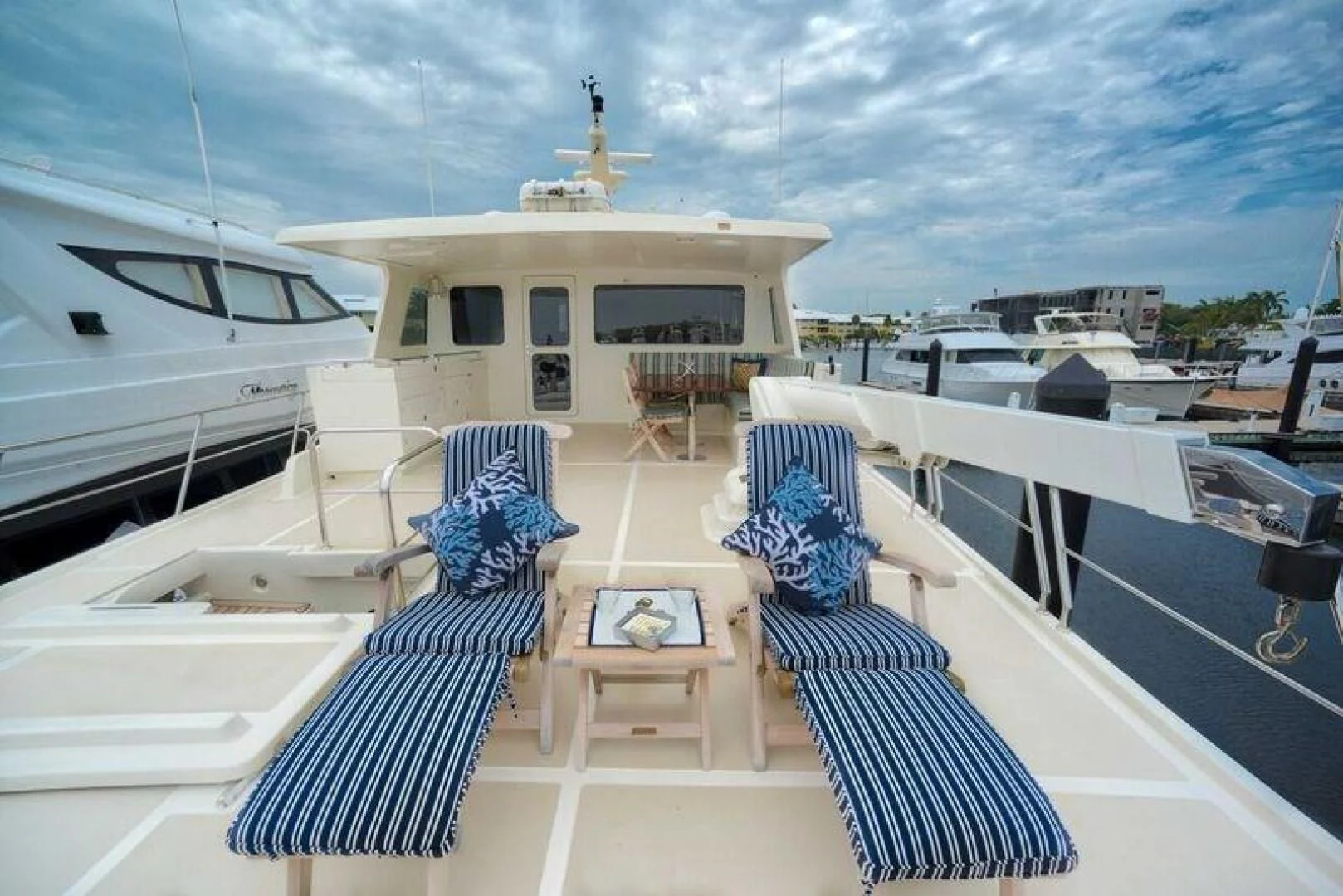 a deck with a boat and a building on it aboard GRACIE Yacht for Sale