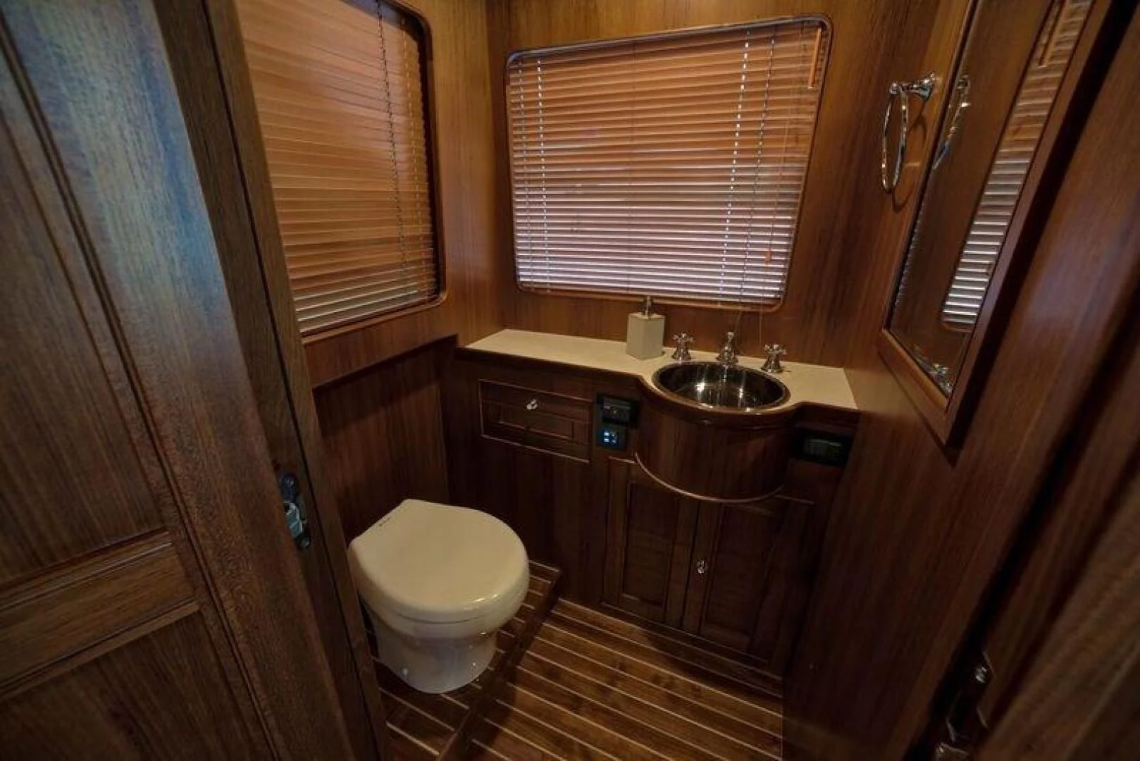 a bathroom with a sink and a toilet aboard GRACIE Yacht for Sale
