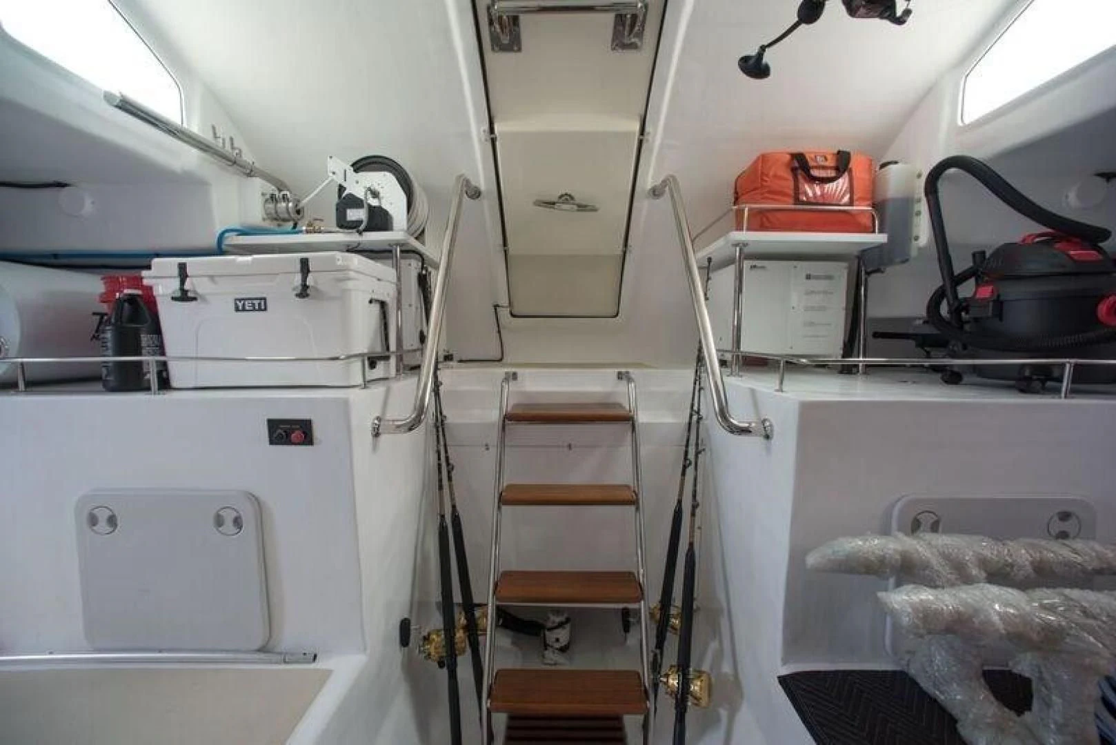 a room with white cabinets and white walls aboard GRACIE Yacht for Sale