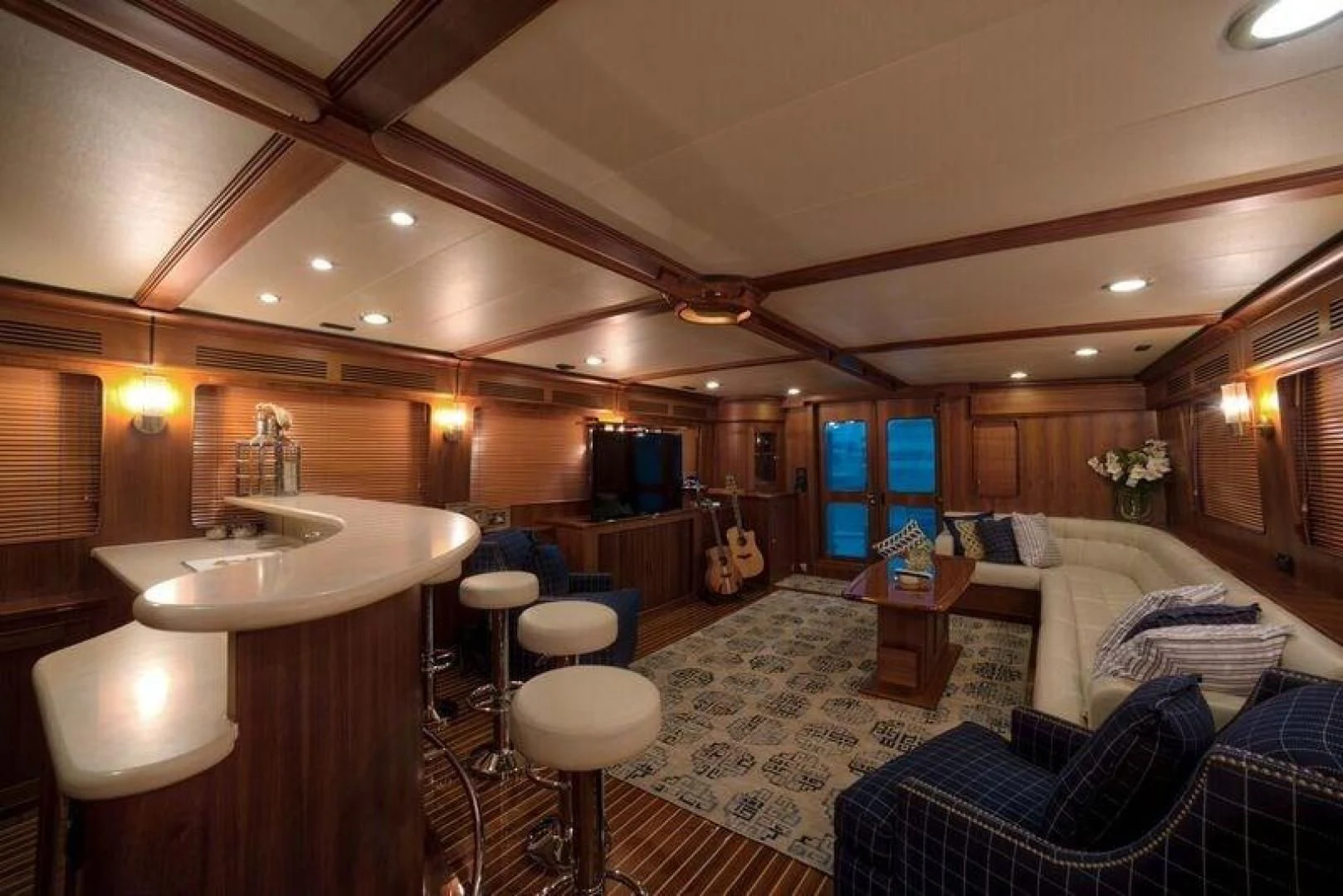 a large room with a bed and a sink aboard GRACIE Yacht for Sale