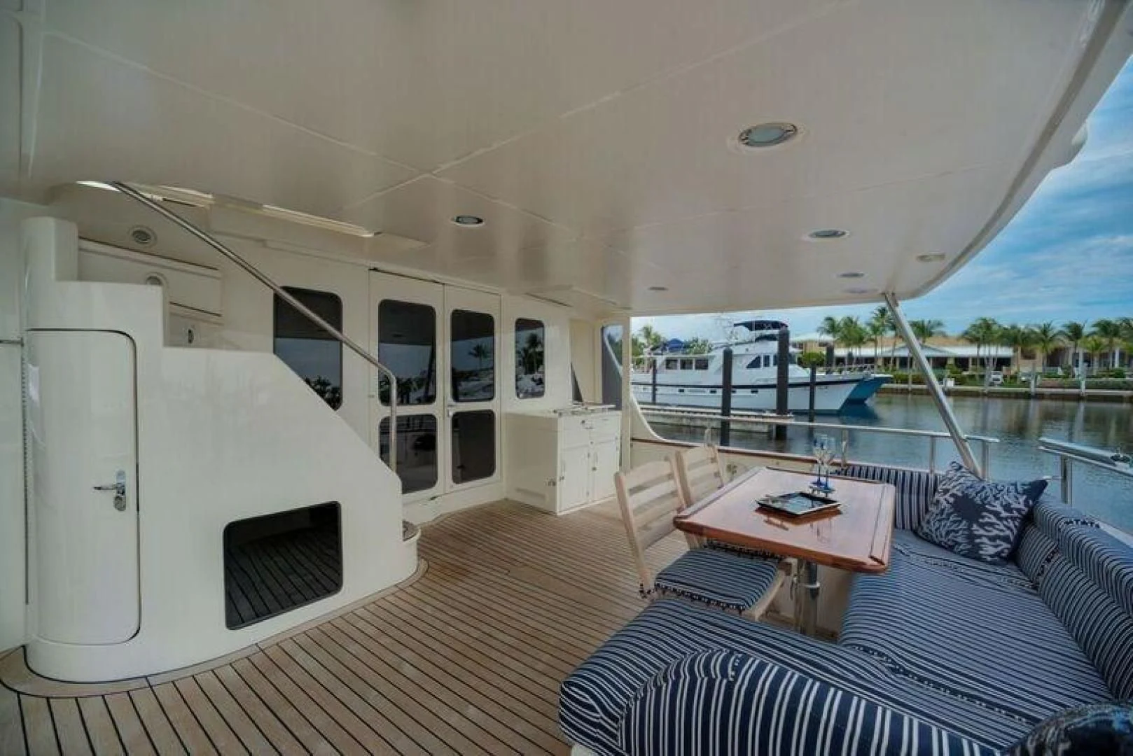 a large white boat on a deck aboard GRACIE Yacht for Sale