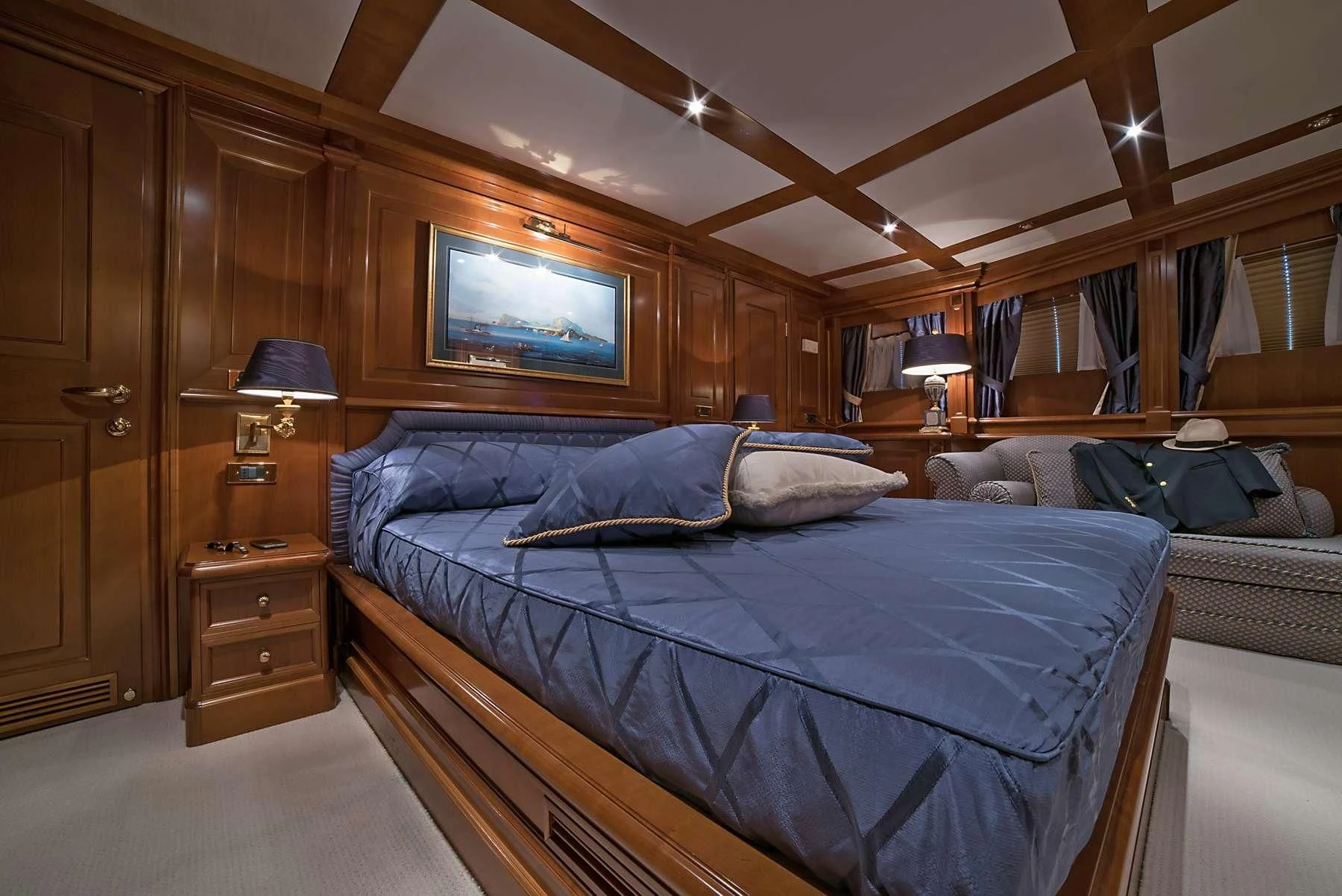a room with a bed and a television aboard ANNE MARIE Yacht for Sale