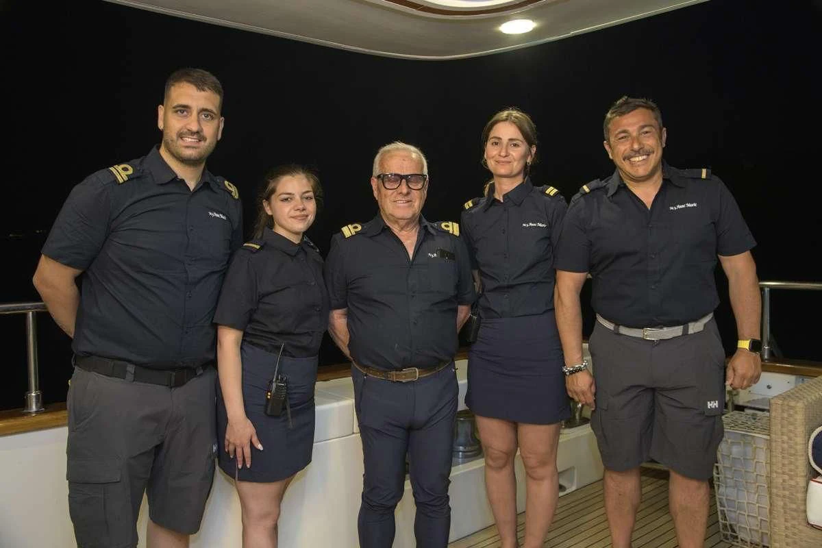 a group of people posing for a photo aboard ANNE MARIE Yacht for Sale