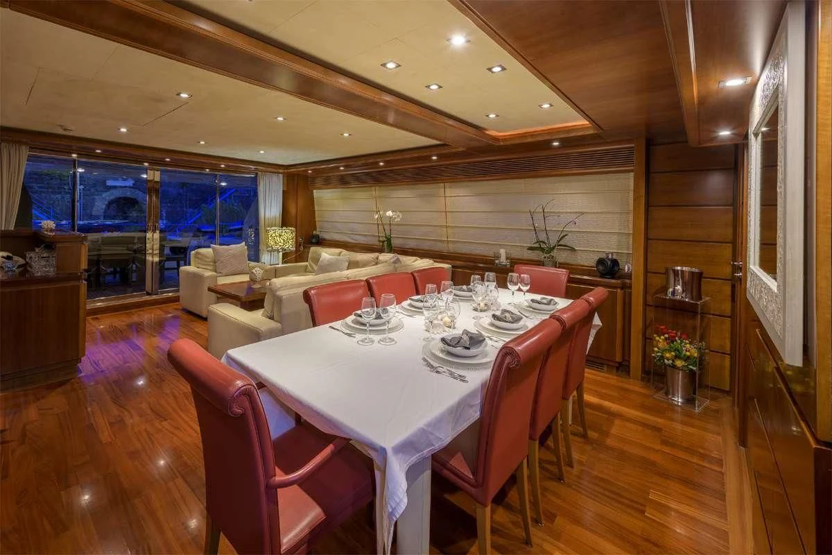 a dining room with a table and chairs aboard ANNE MARIE Yacht for Sale