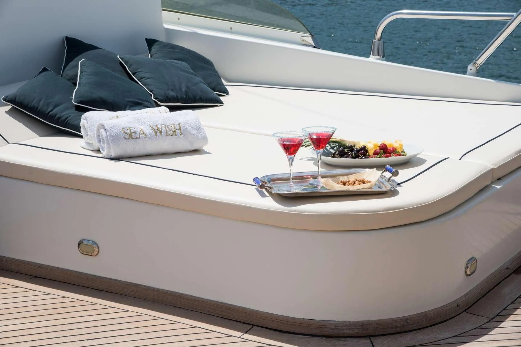 a table with food and drinks on it aboard ANNE MARIE Yacht for Sale