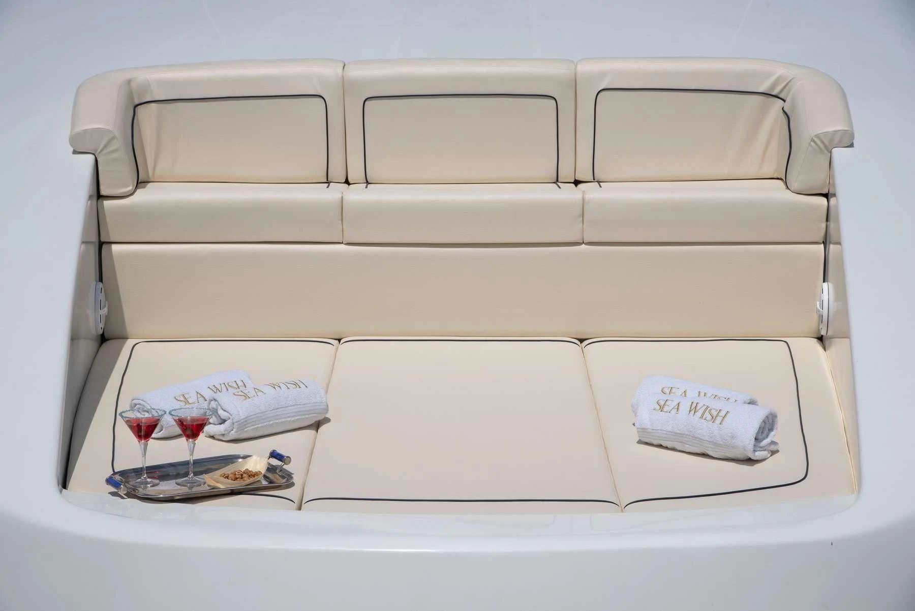 a white rectangular object with a silver tray and a silver tray with a red candle and a white aboard ANNE MARIE Yacht for Sale