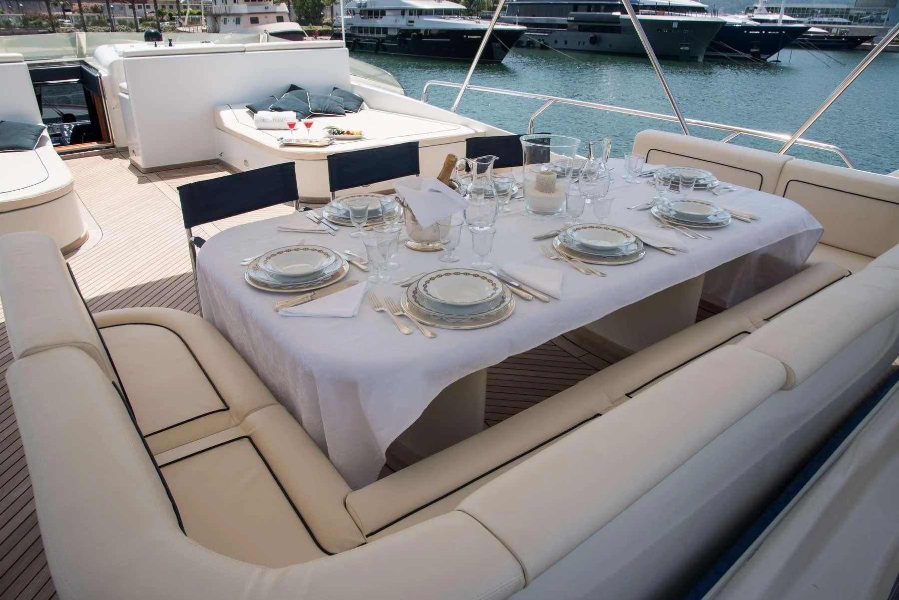 a table set for a dinner on a boat aboard ANNE MARIE Yacht for Sale
