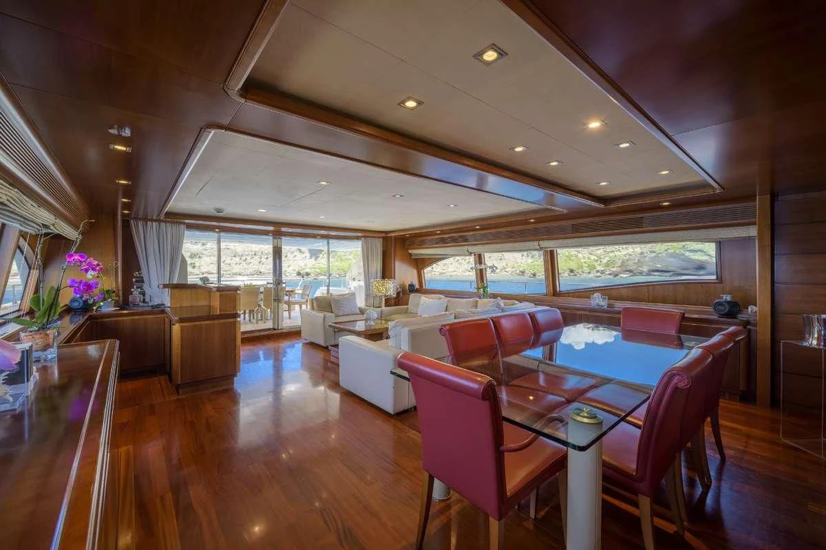 a large living room with a large open window aboard ANNE MARIE Yacht for Sale