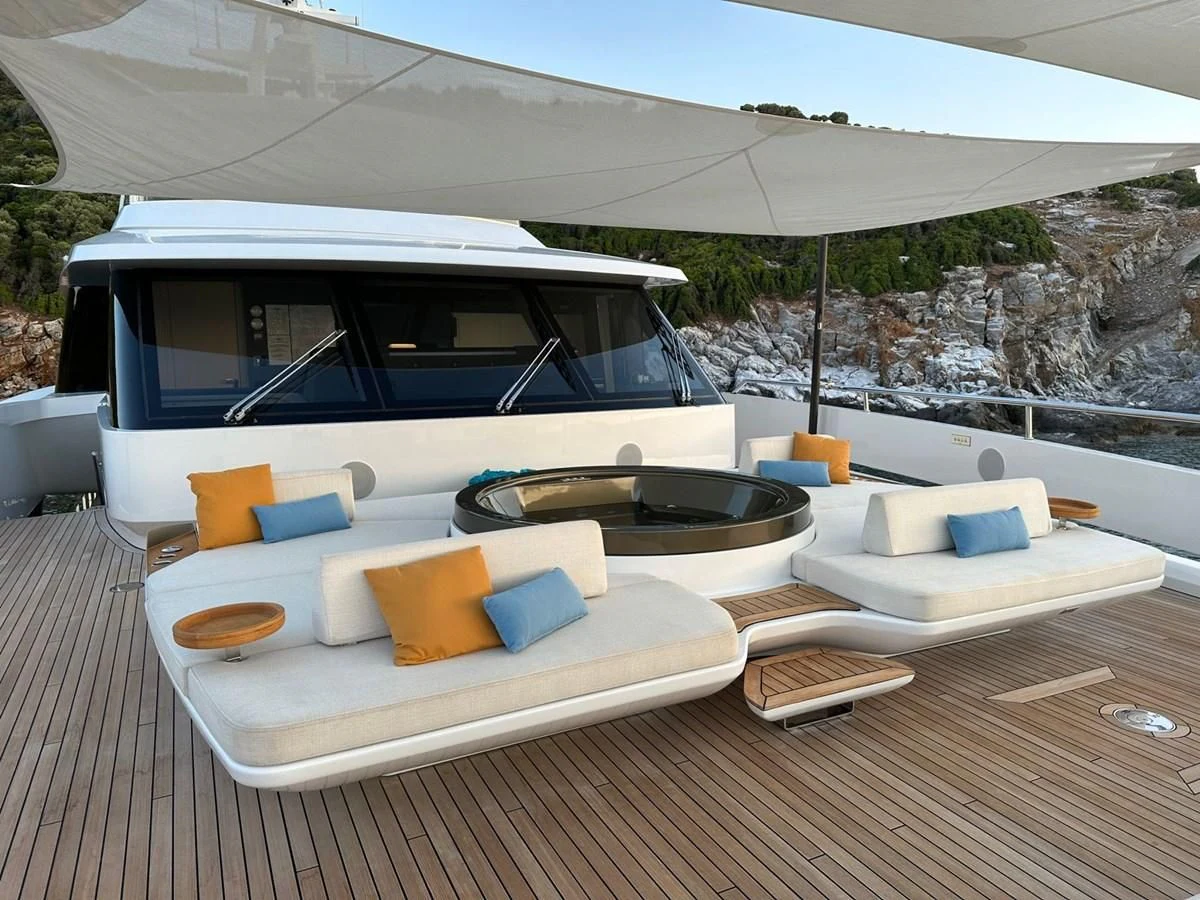 a white tent with a white roof and a white lounge chair aboard NG Yacht for Sale