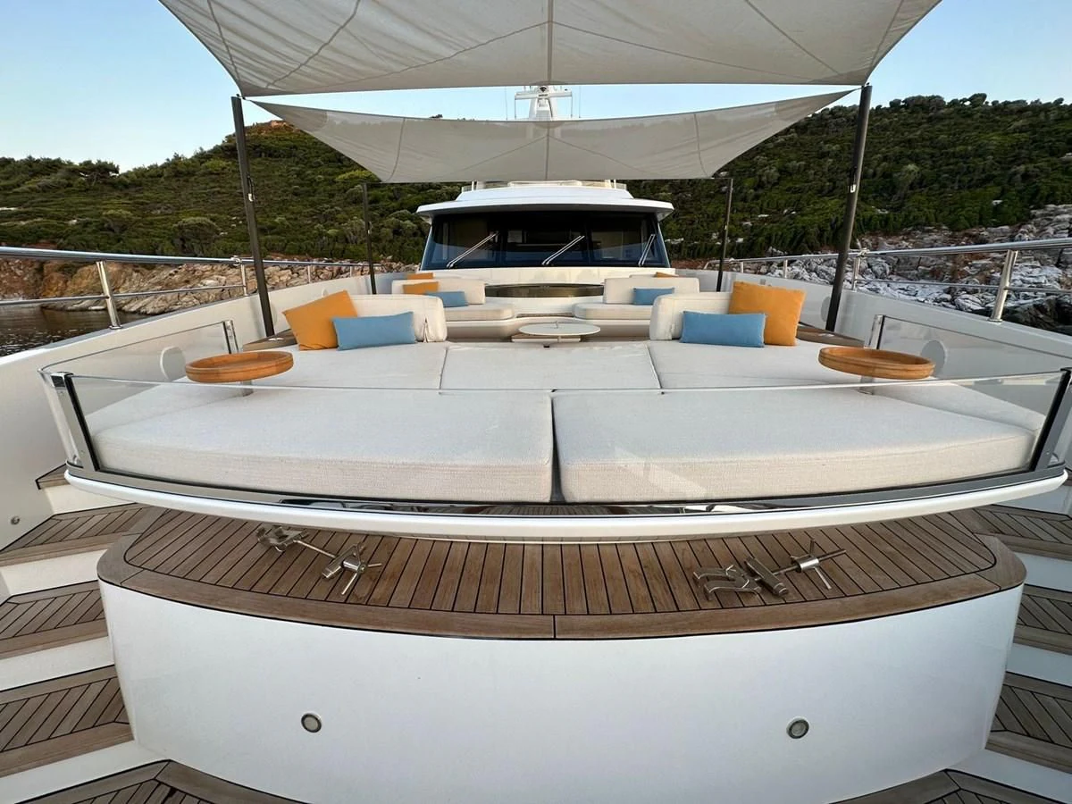 a white boat on a deck aboard NG Yacht for Sale