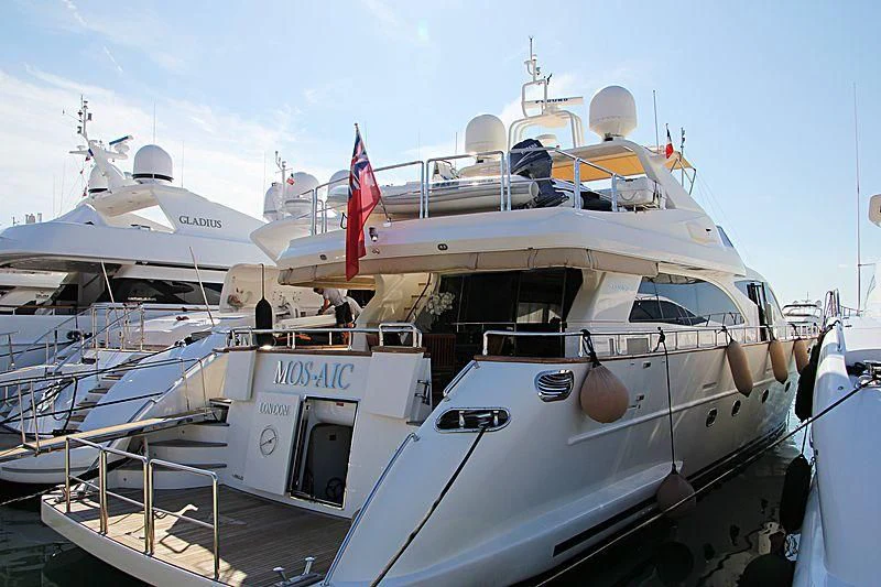 a boat docked at a pier aboard MOS-AIC Yacht for Sale