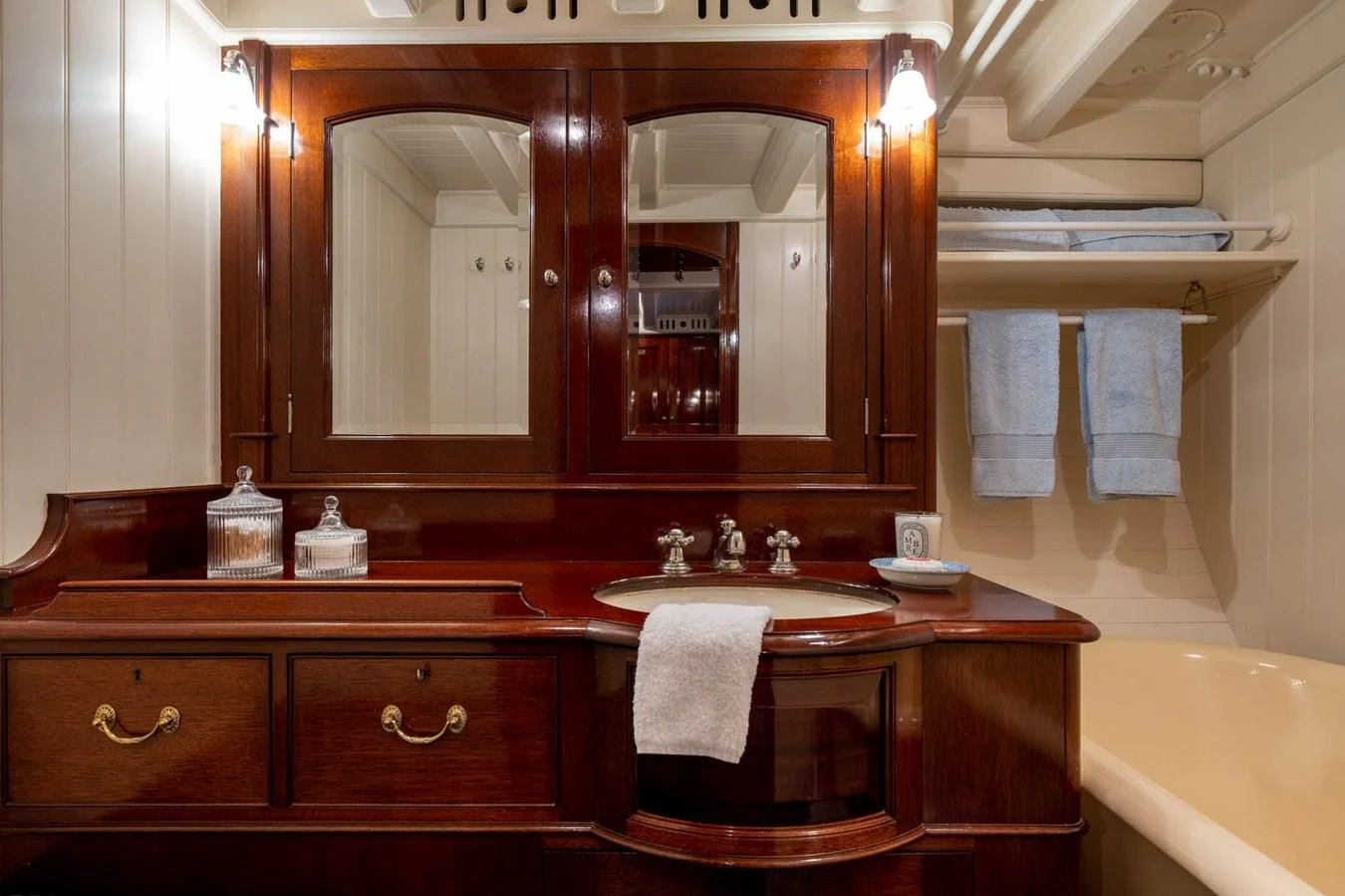 a bathroom with a large mirror aboard SAVANNAH Yacht for Sale