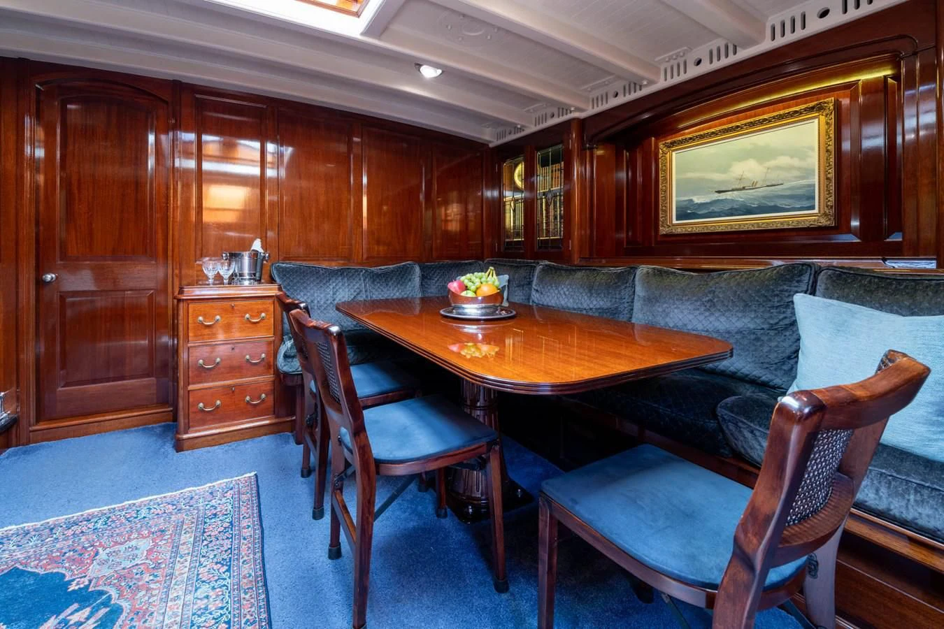 a living room with a couch and a table aboard SAVANNAH Yacht for Sale