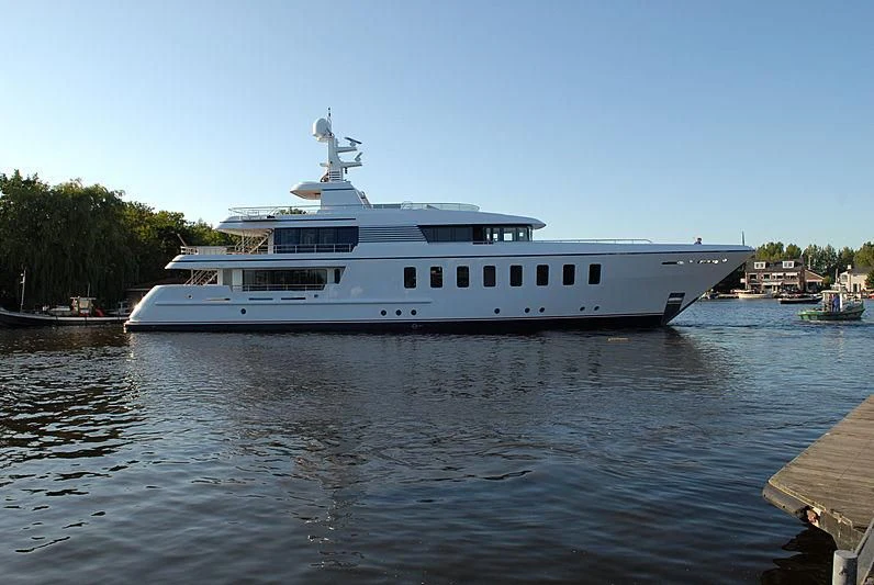 a large white boat on a body of water aboard MEGAN Yacht for Sale