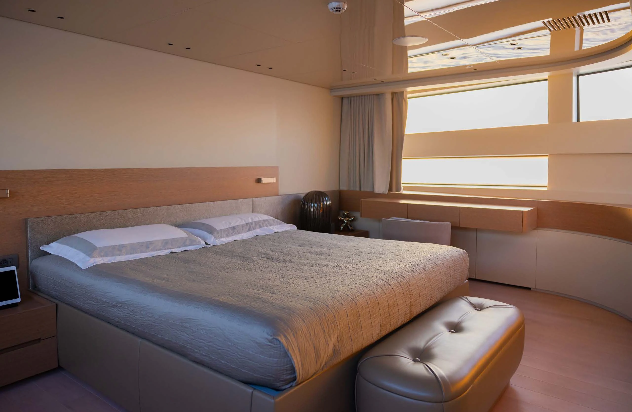 a room with a bed and a chair aboard AMIGA Yacht for Sale