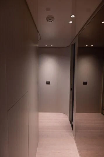 a hallway with white walls aboard AMIGA Yacht for Sale