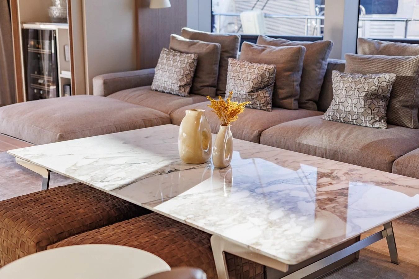 a living room with a couch and a coffee table aboard AMIGA Yacht for Sale