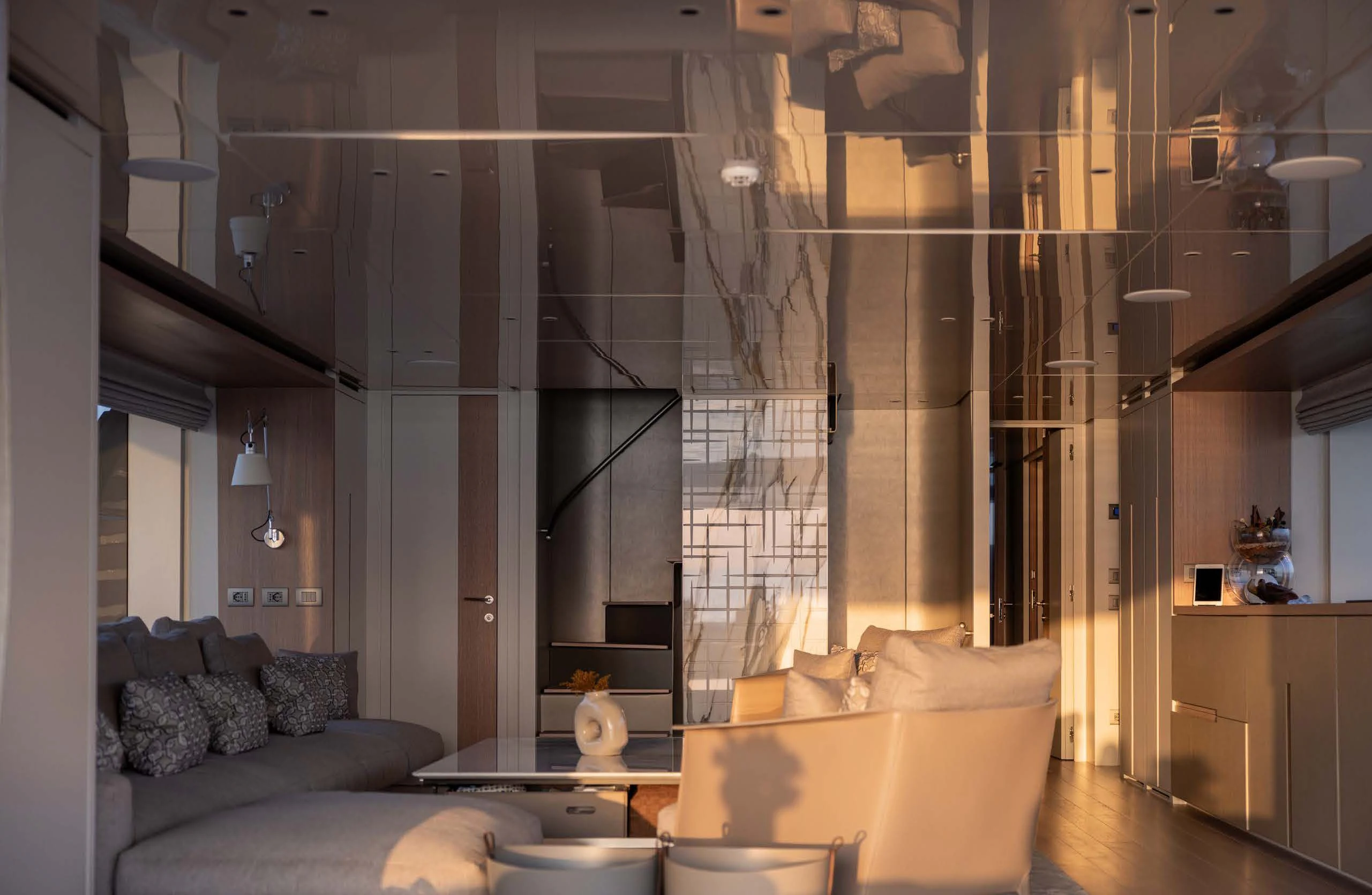 a room with a couch and a glass wall aboard AMIGA Yacht for Sale