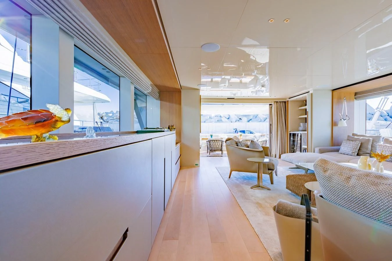 a living room with a large window aboard AMIGA Yacht for Sale
