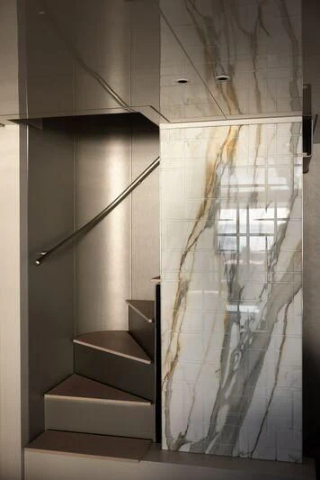 a staircase with glass walls aboard AMIGA Yacht for Sale