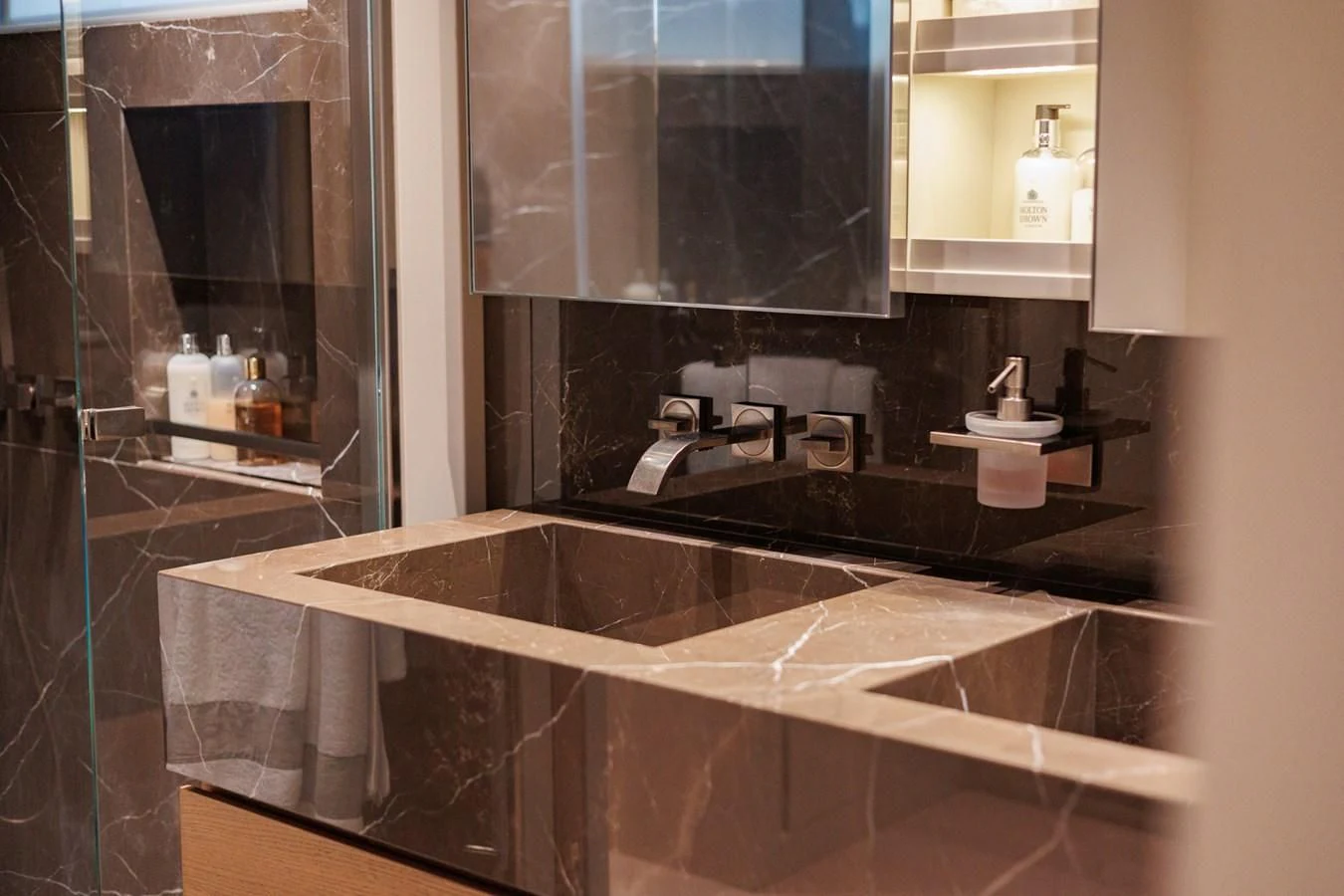 a bathroom with a countertop sink aboard AMIGA Yacht for Sale