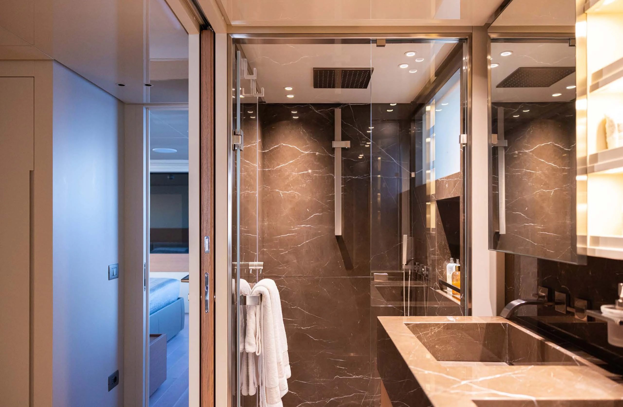 a bathroom with a sink and a bathtub aboard AMIGA Yacht for Sale