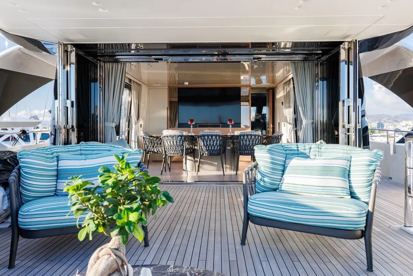 a room with chairs and tables aboard AMIGA Yacht for Sale