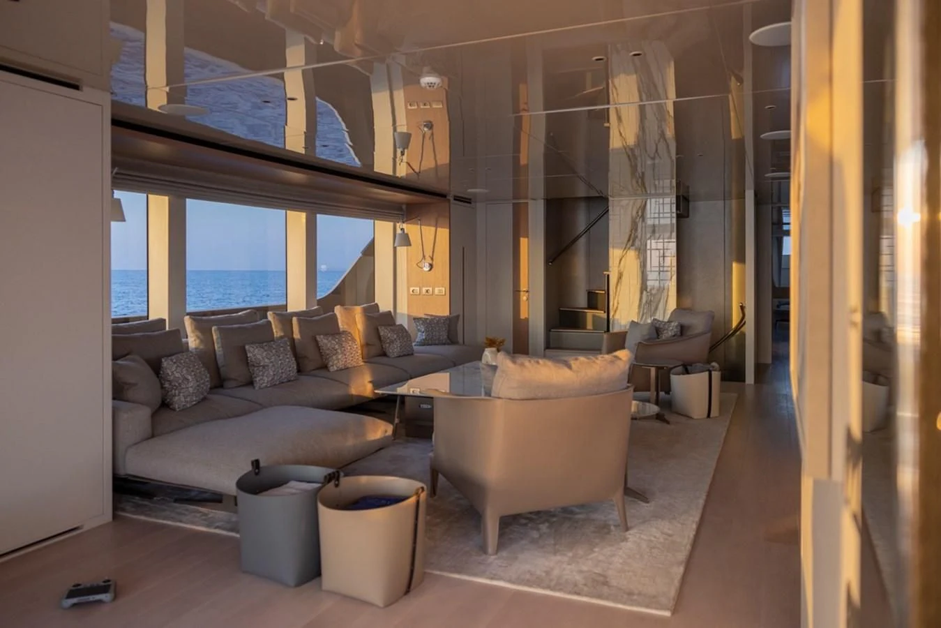 a living room with a couch and a table aboard AMIGA Yacht for Sale