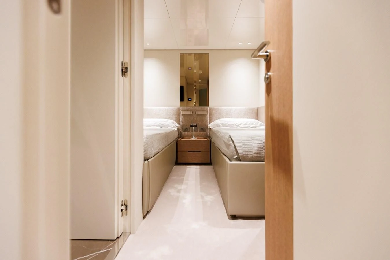 a room with a bed and a mirror aboard AMIGA Yacht for Sale
